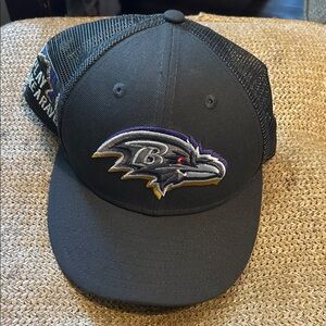 New Era Black Mesh Trucker Hat with White Logo Label